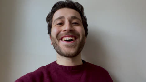 Young-Male-University-Student-Talking-and-Raising-Glass-Directly-to-Camera